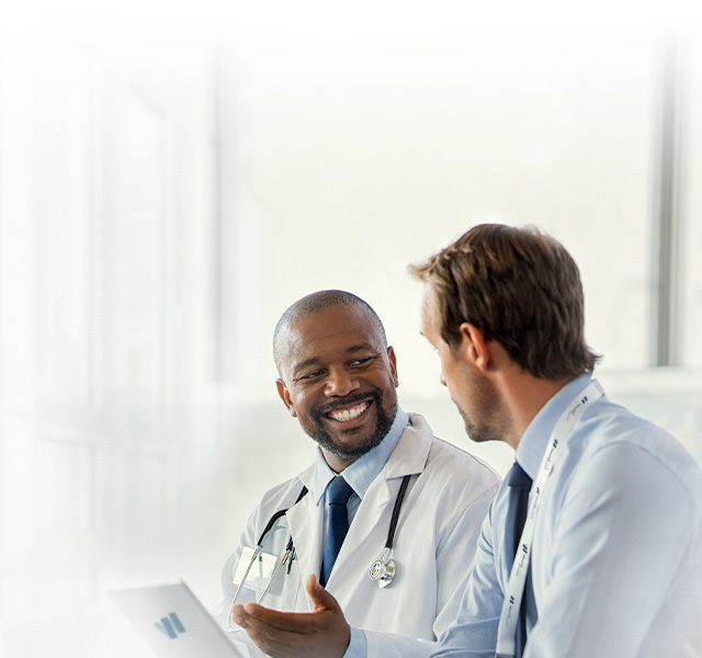 Background Image of 2 wound care doctors discussing healing